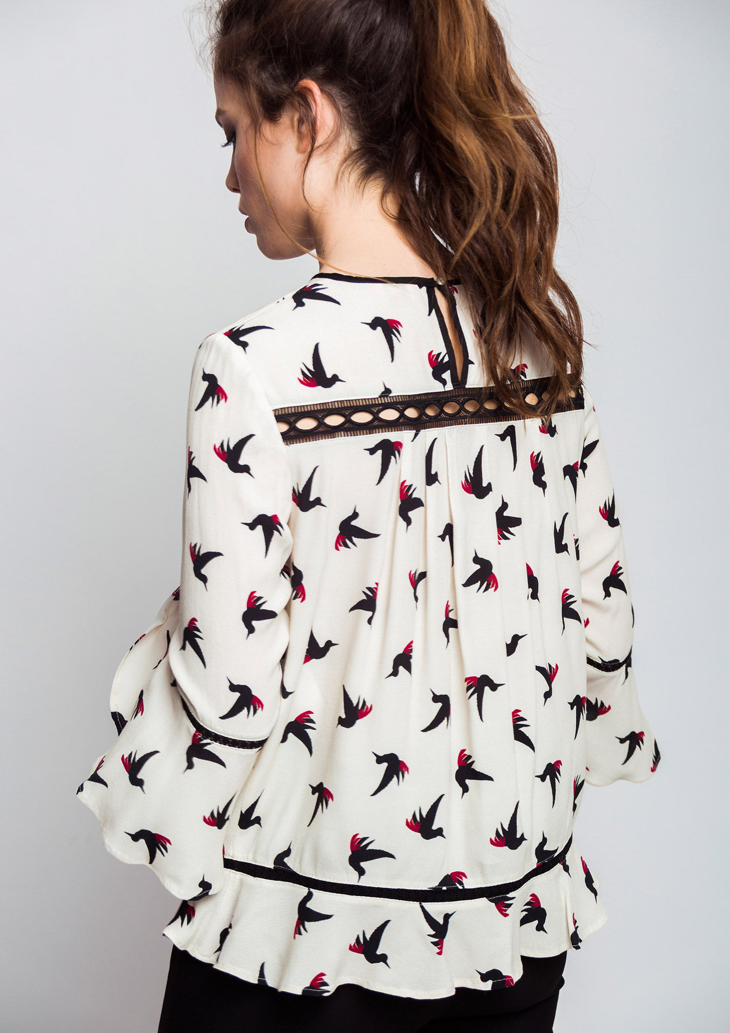 Bird print blouse.