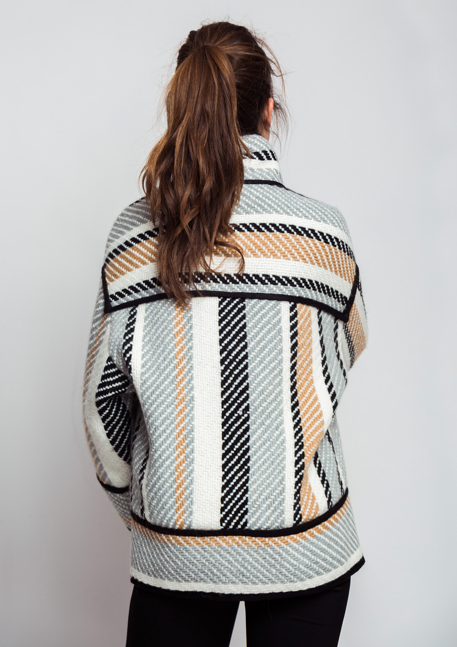 Striped jacket with black piping.