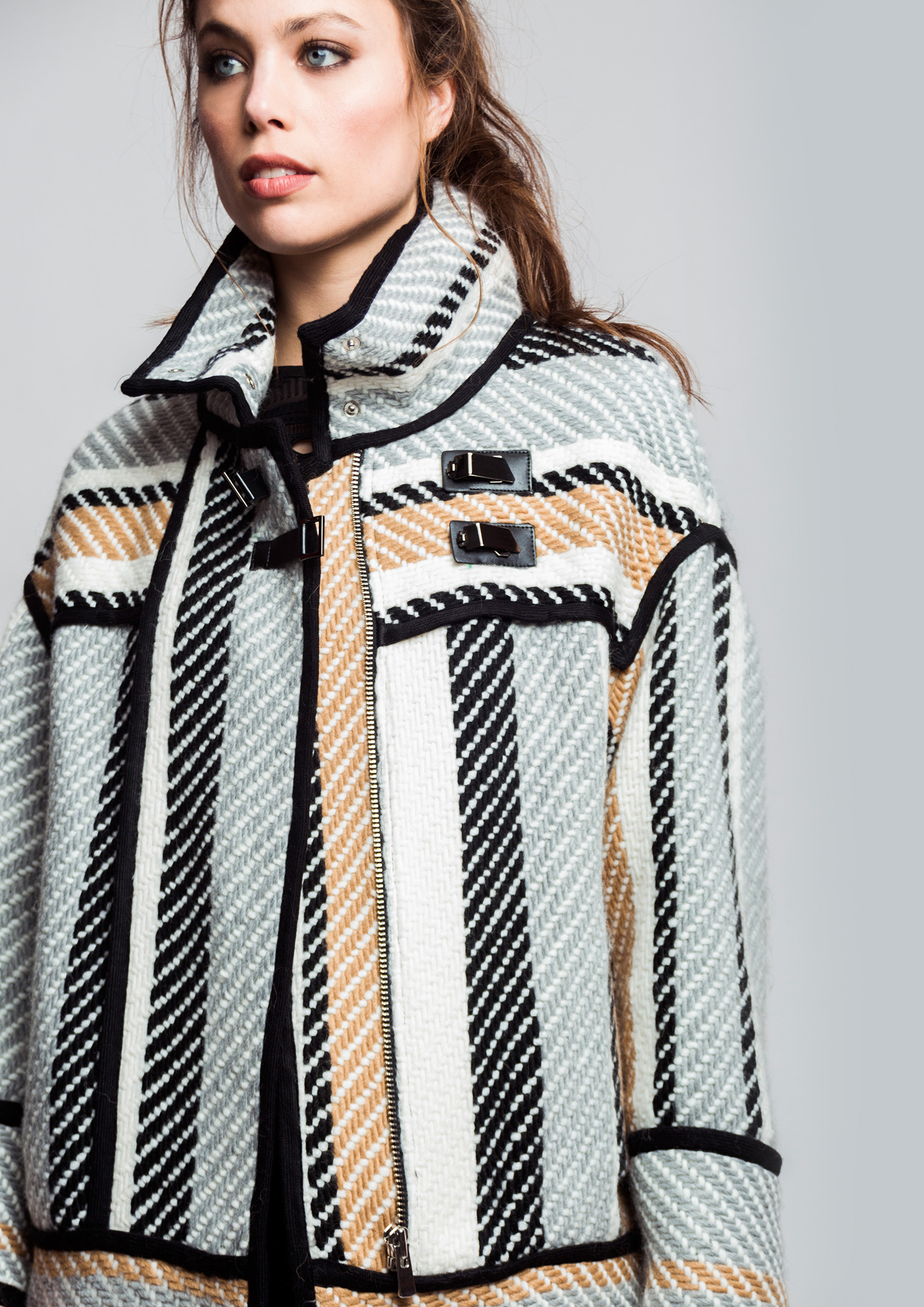 Striped jacket with black piping.