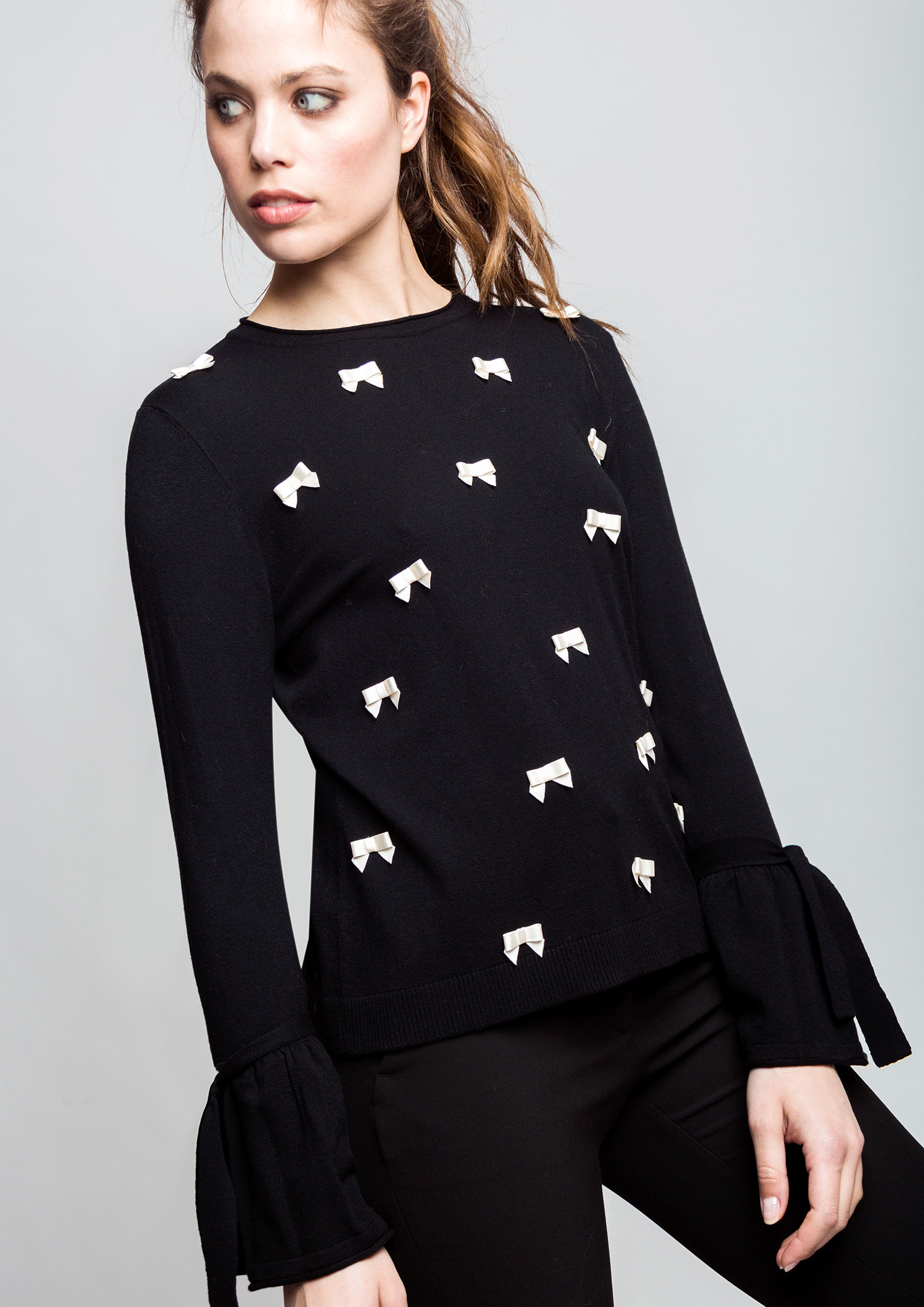 Black bow jumper.