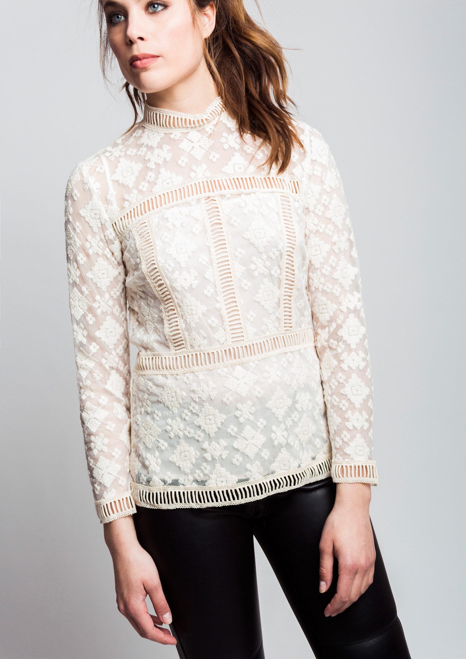 Embroidered blouse with cotton lace trim.