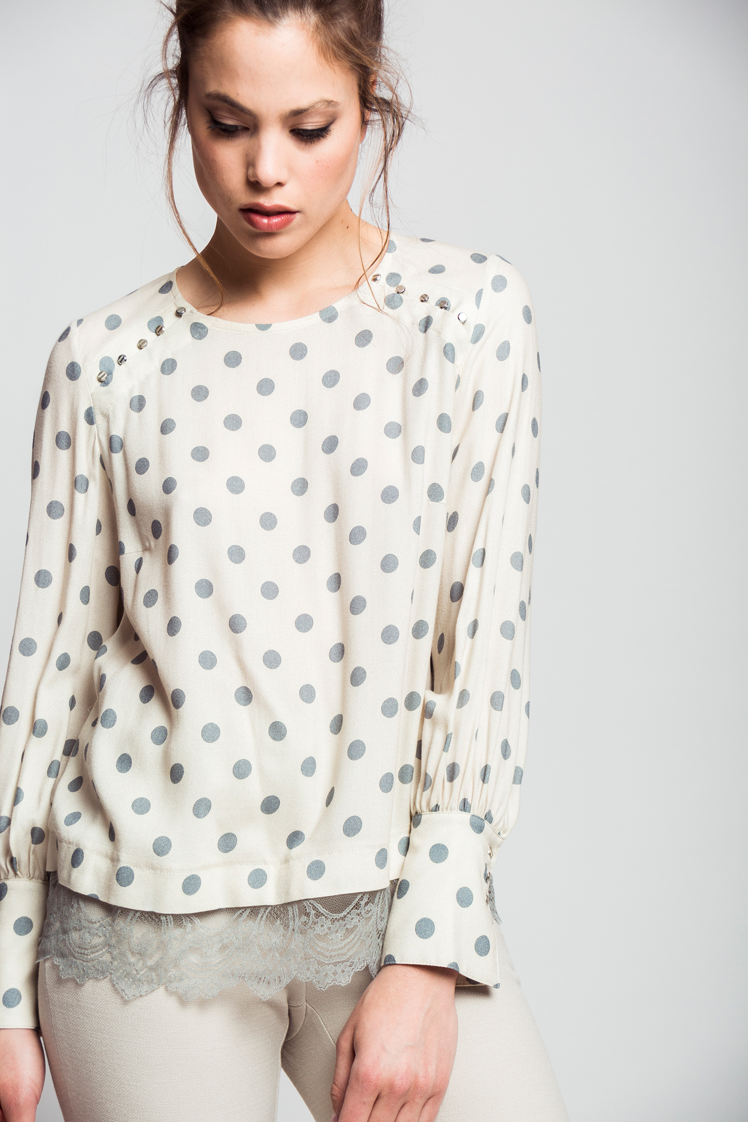 Grey polka dot blouse.