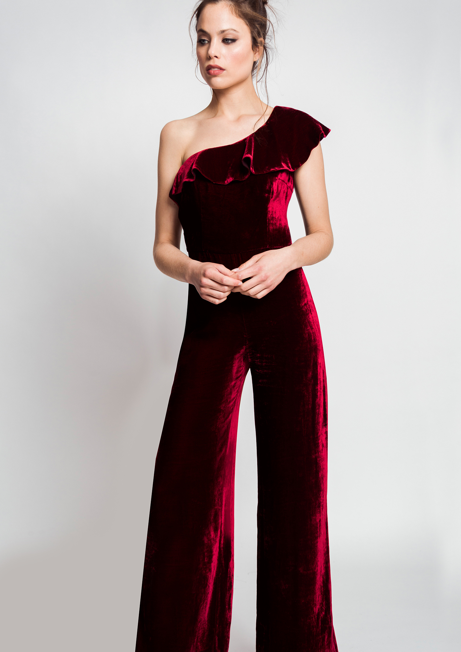 Maroon velvet jumpsuit.
