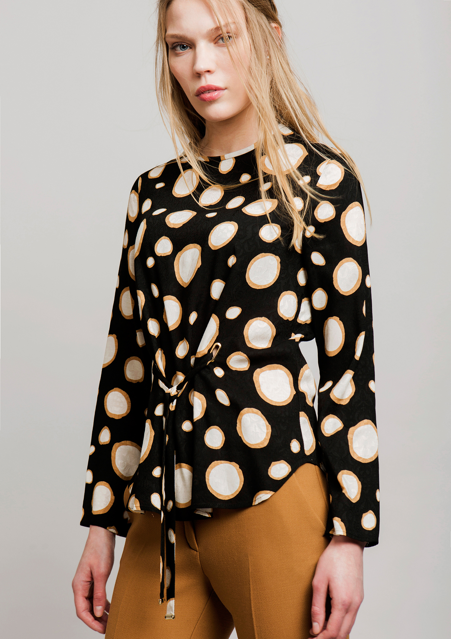 Circle print blouse.