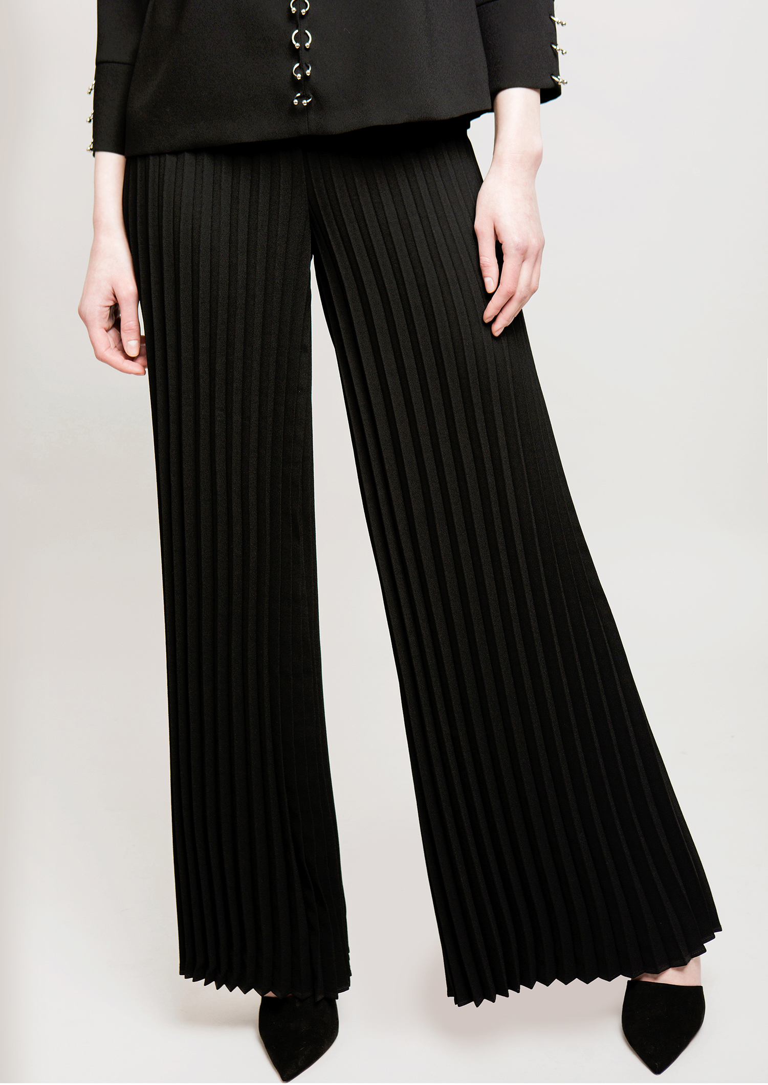 Black pleated trousers.