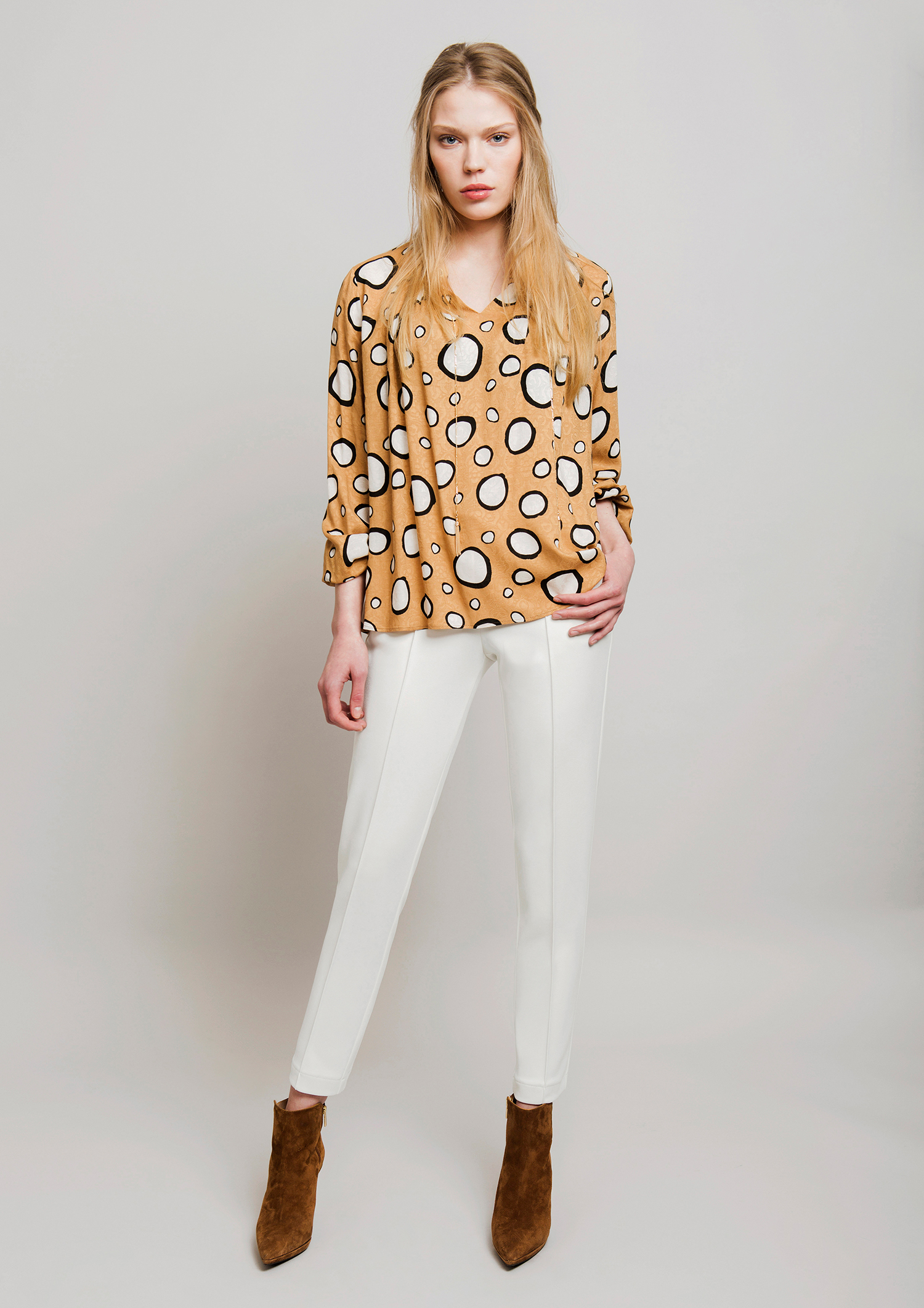 Circle print blouse.