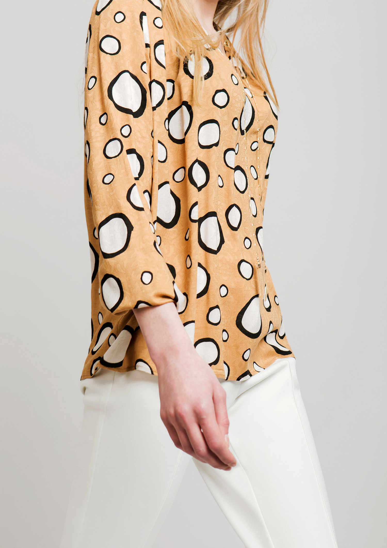 Circle print blouse.