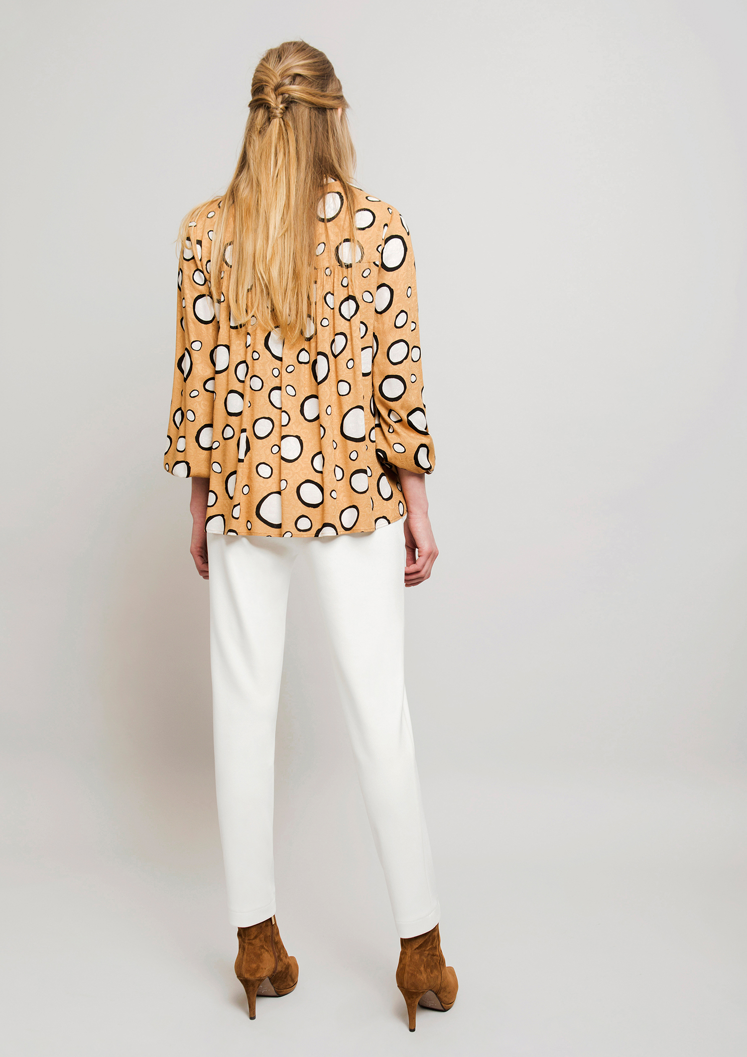 Circle print blouse.