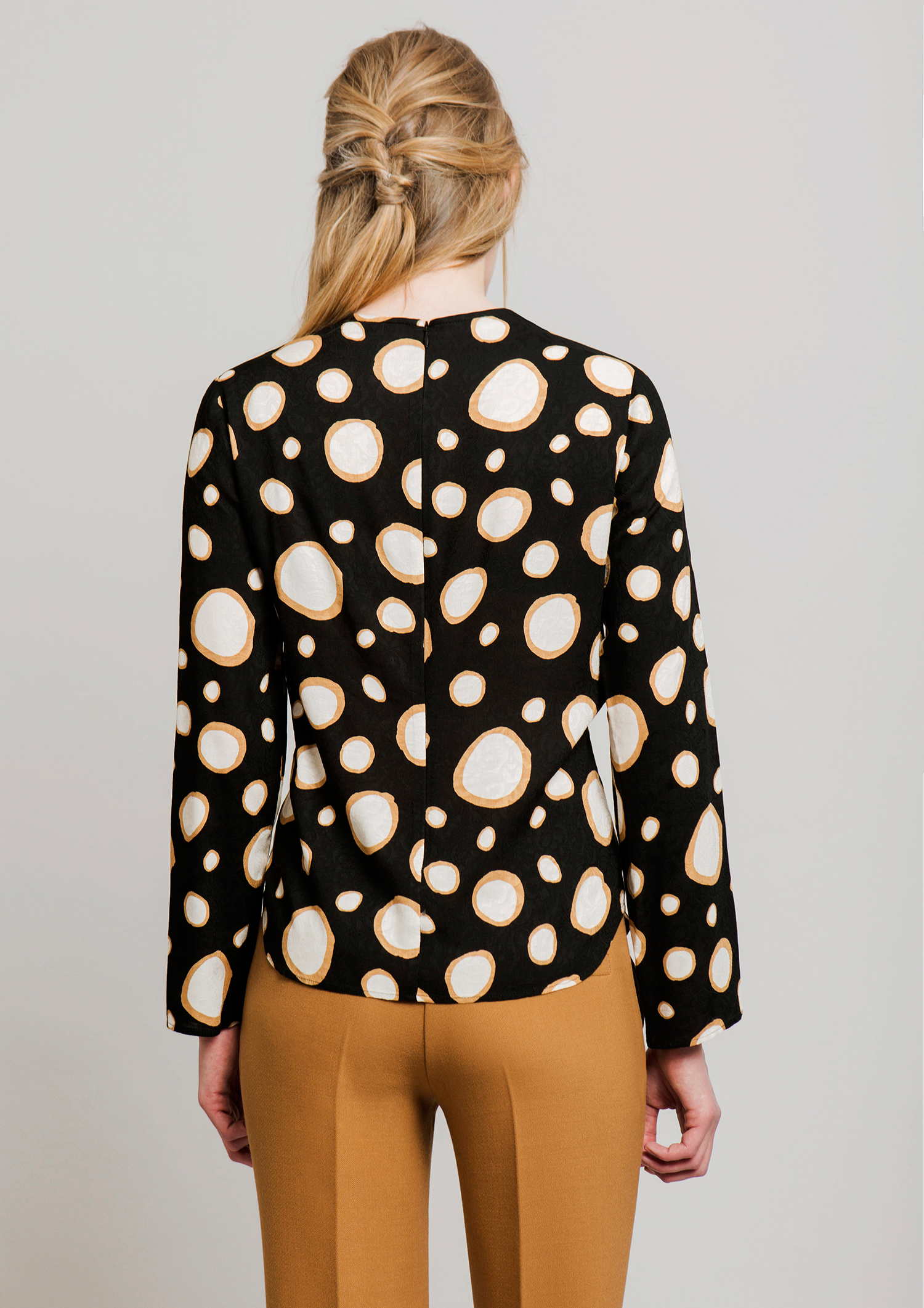 Circle print blouse.