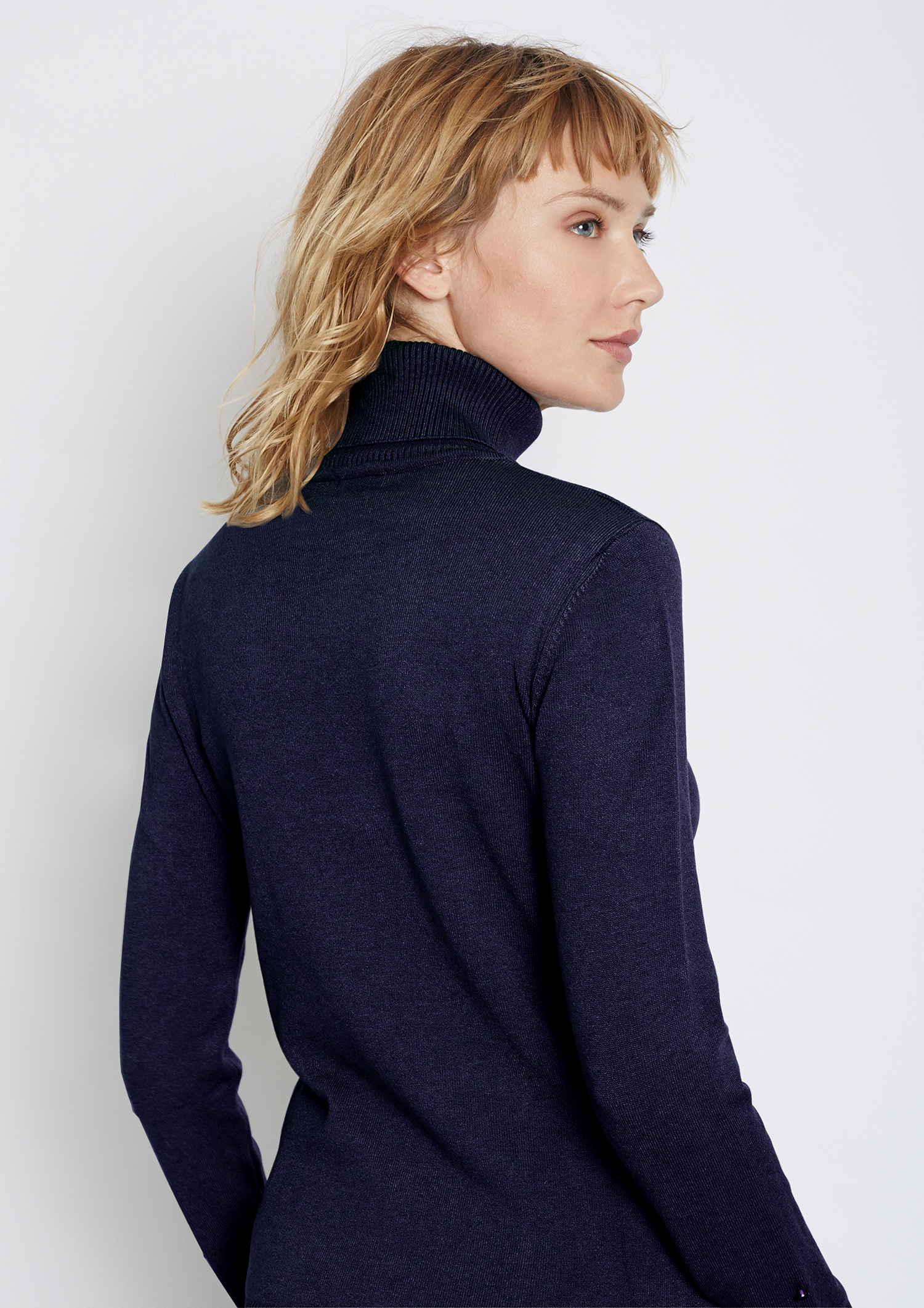 Navy polo neck sweater.