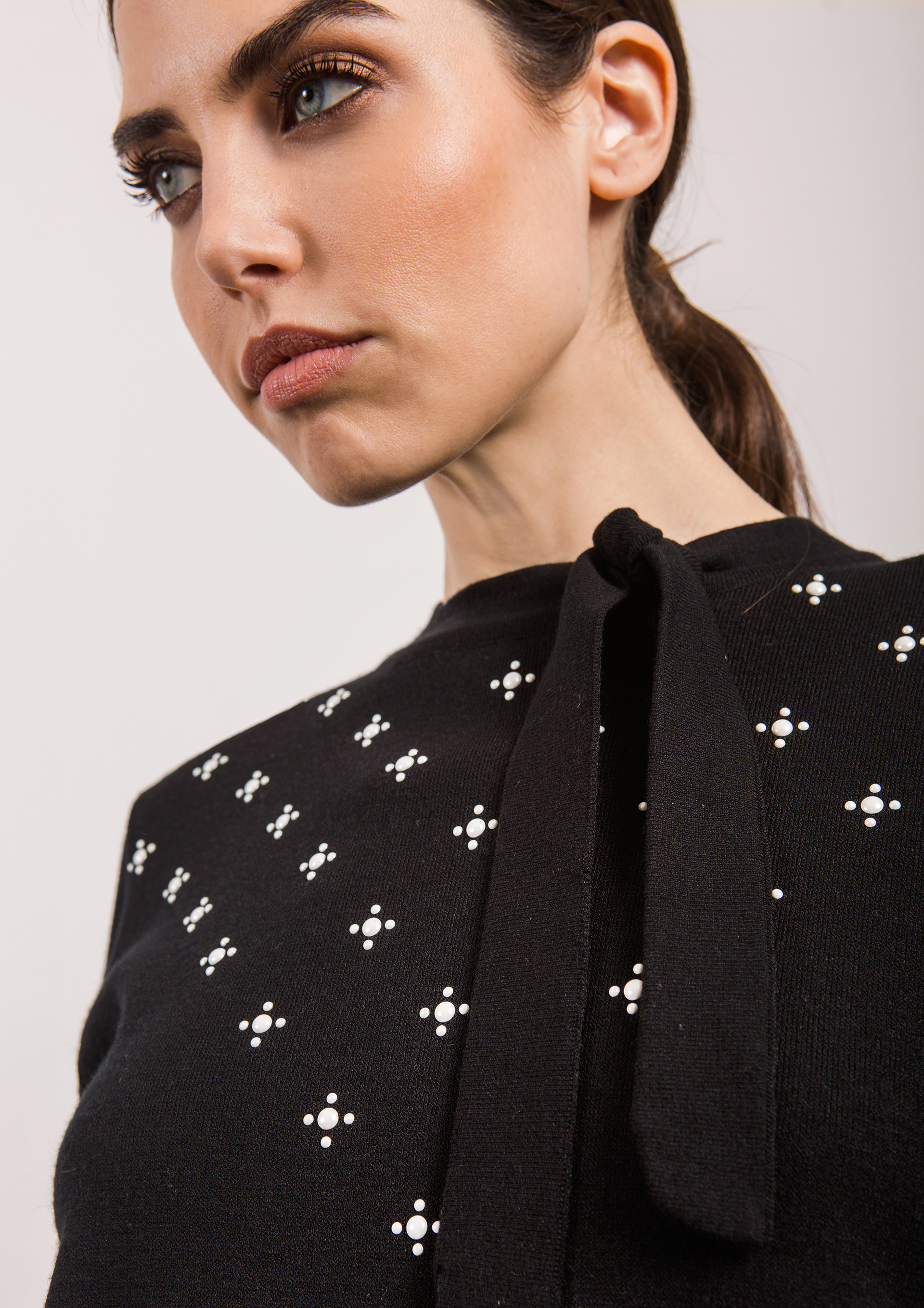 Black sweater with bow neck