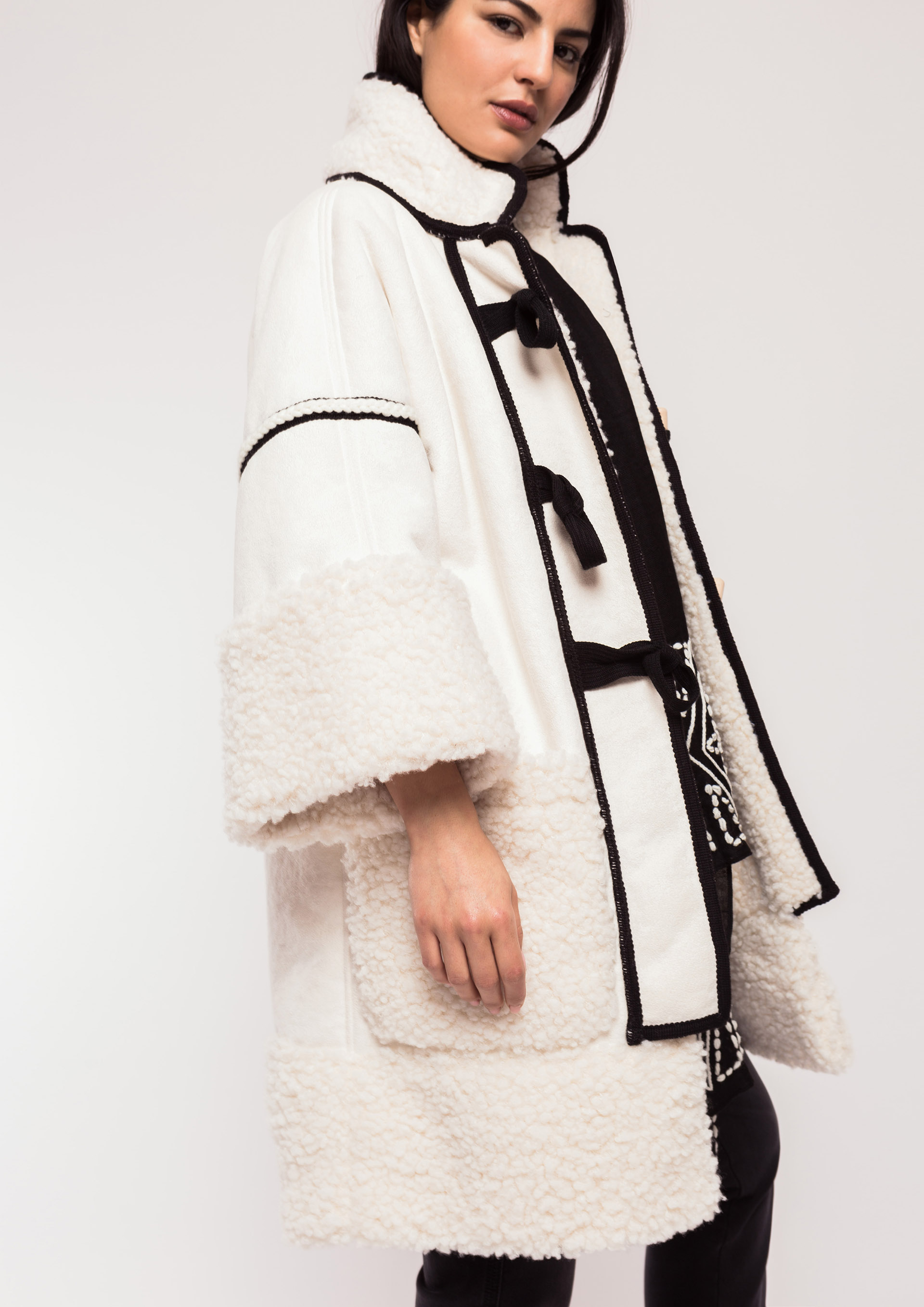 Ecru jacket with black piping