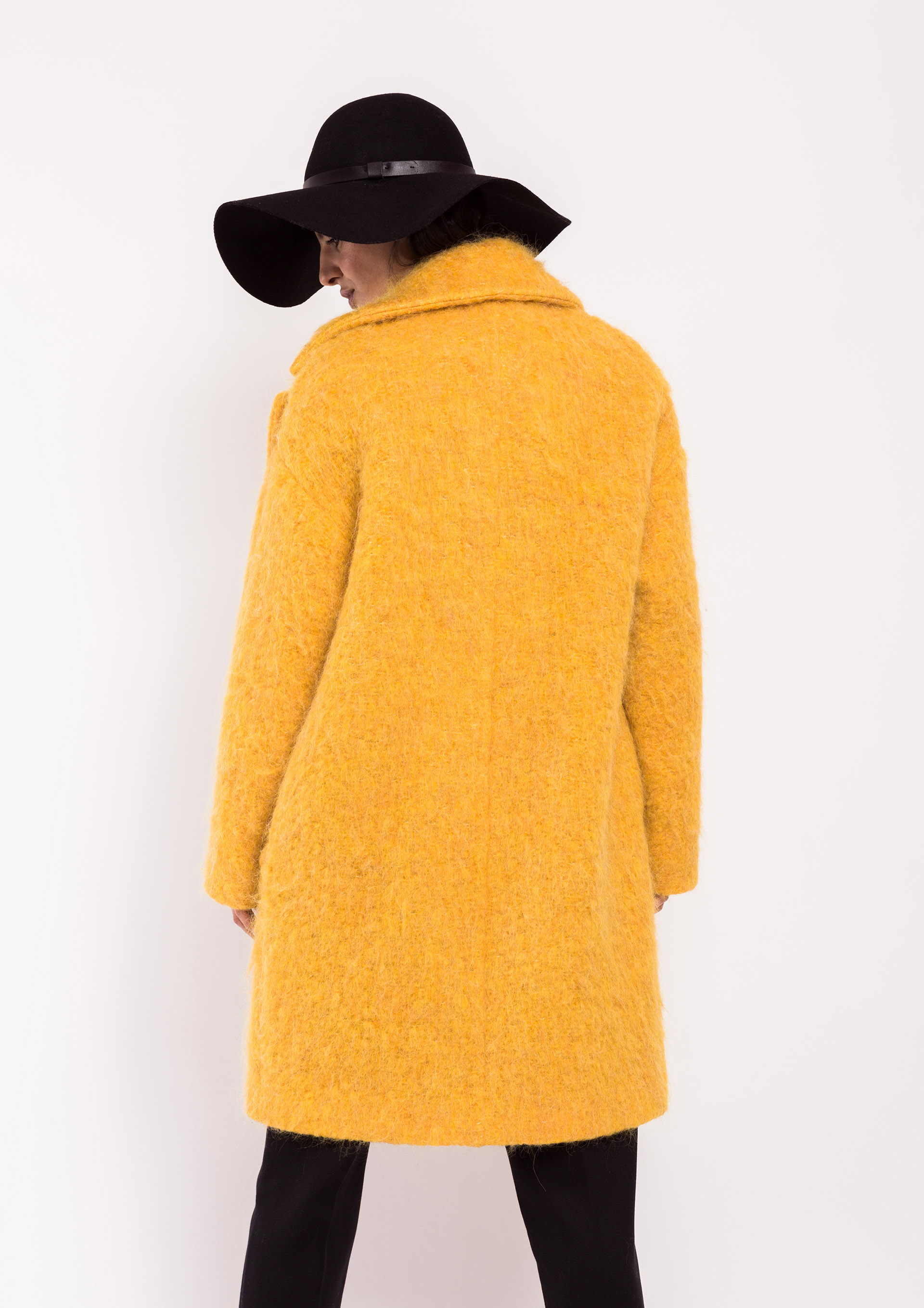 Yellow bouclé coat