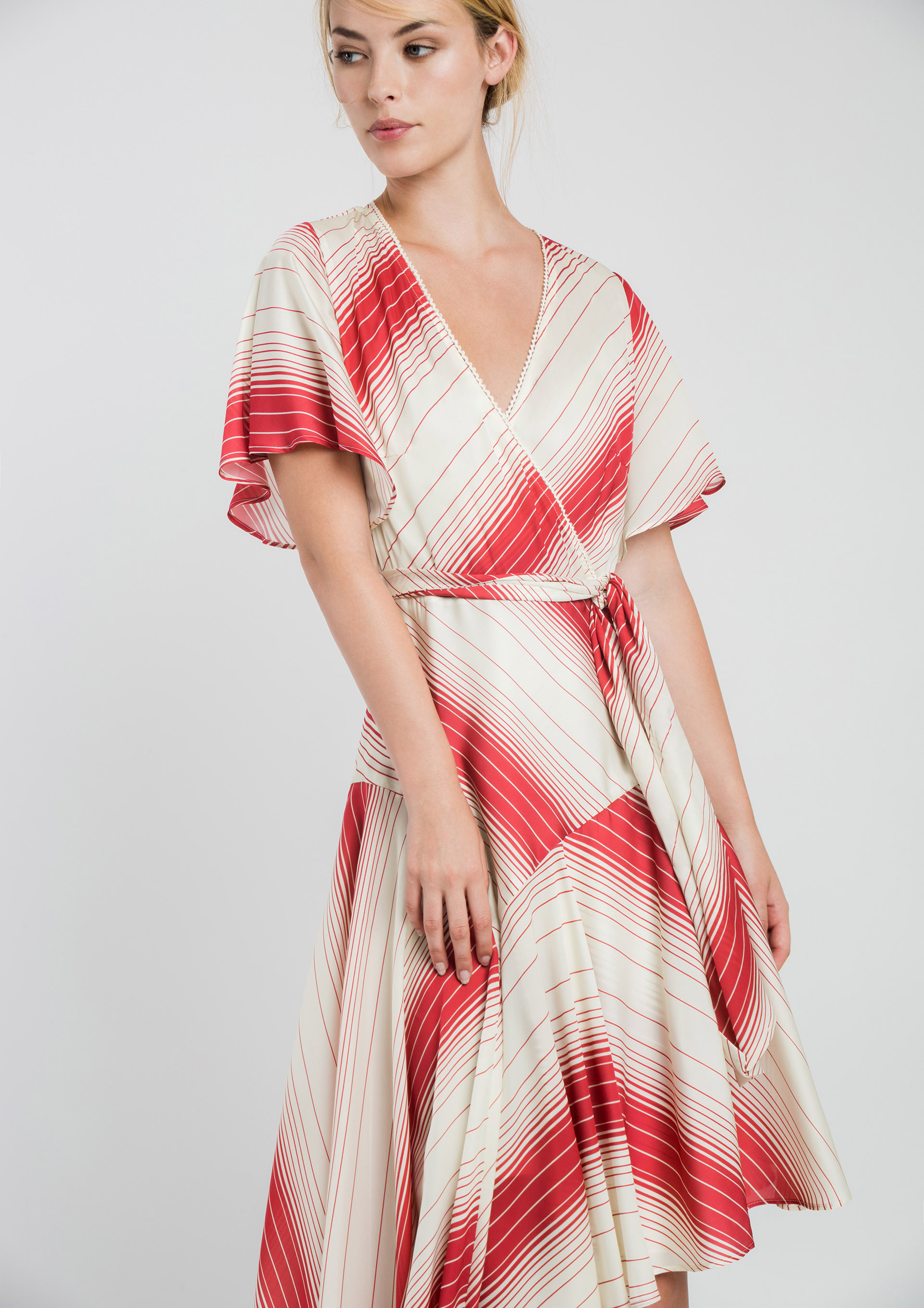 Wrap special occasion dress with asymmetric hemline