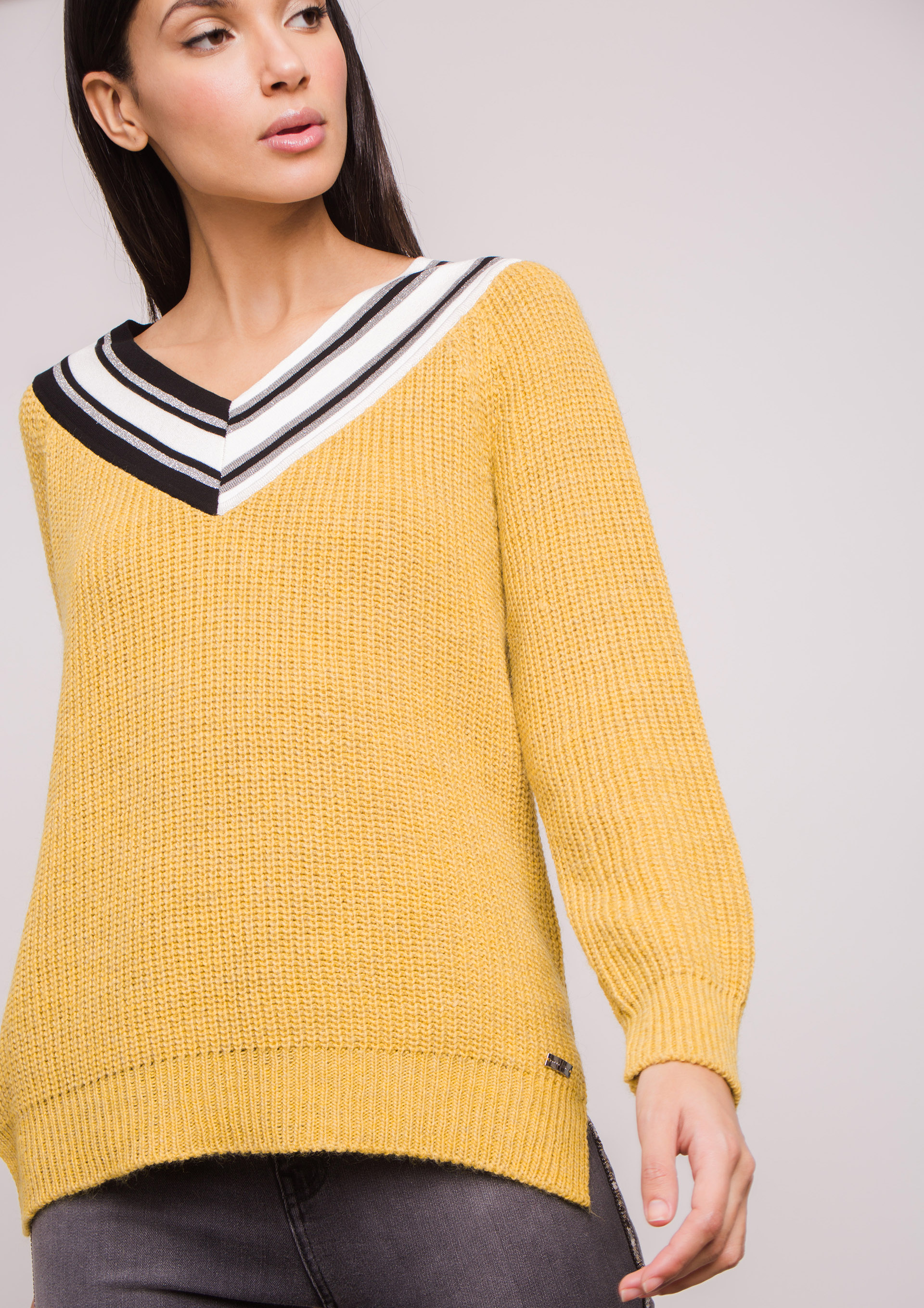 Yellow knit sweater.