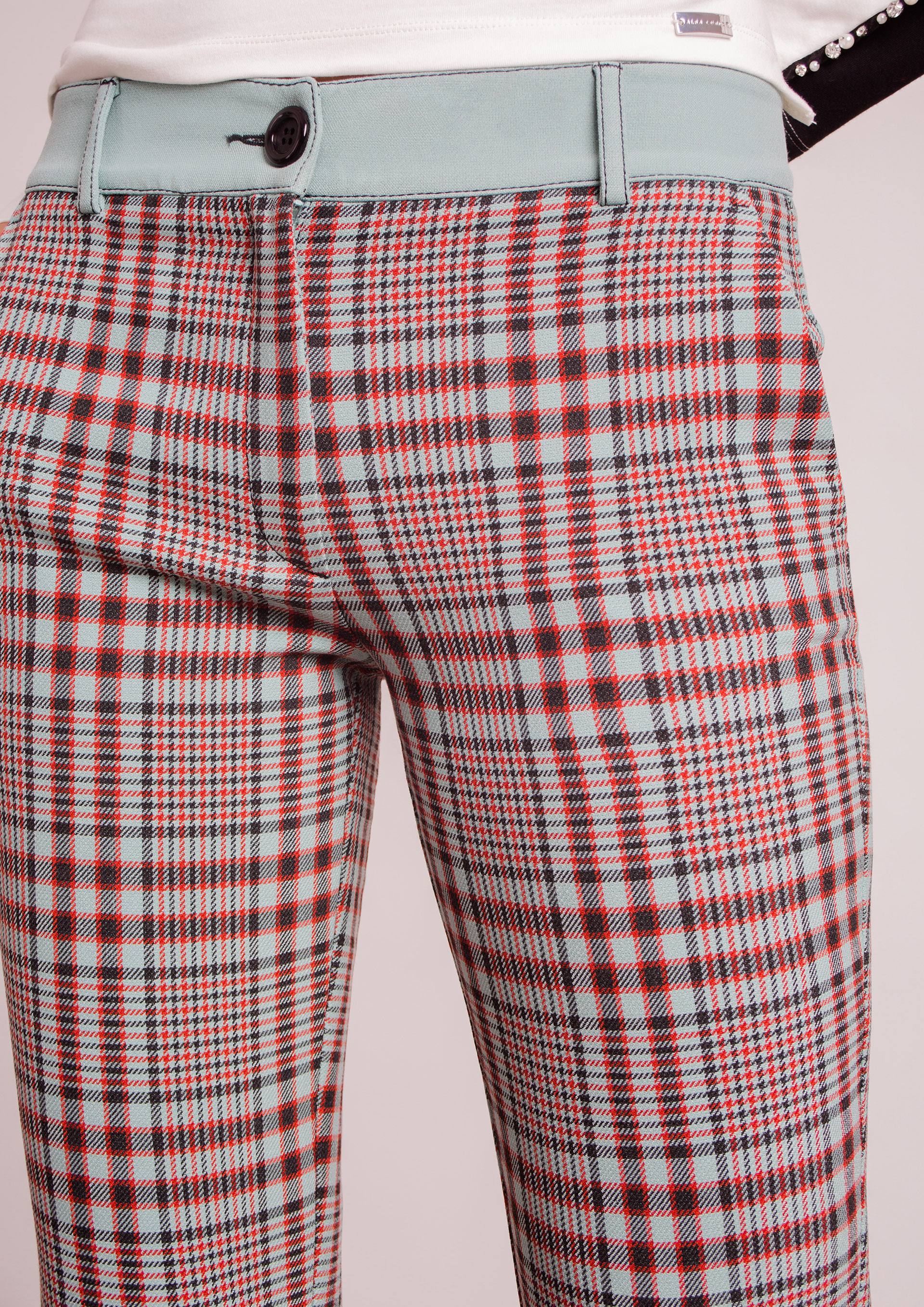 Turquoise checked trousers.