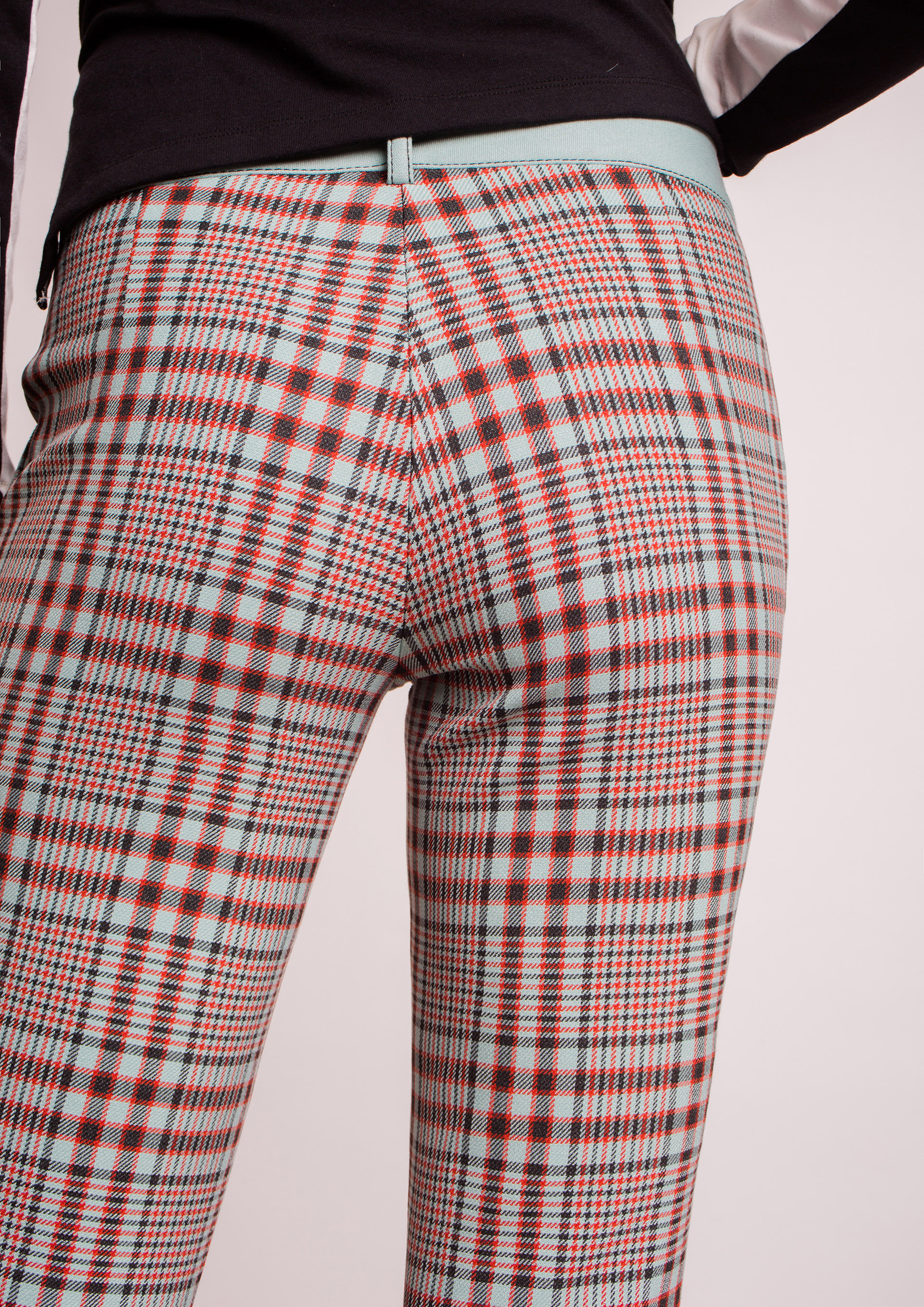 Turquoise checked trousers.