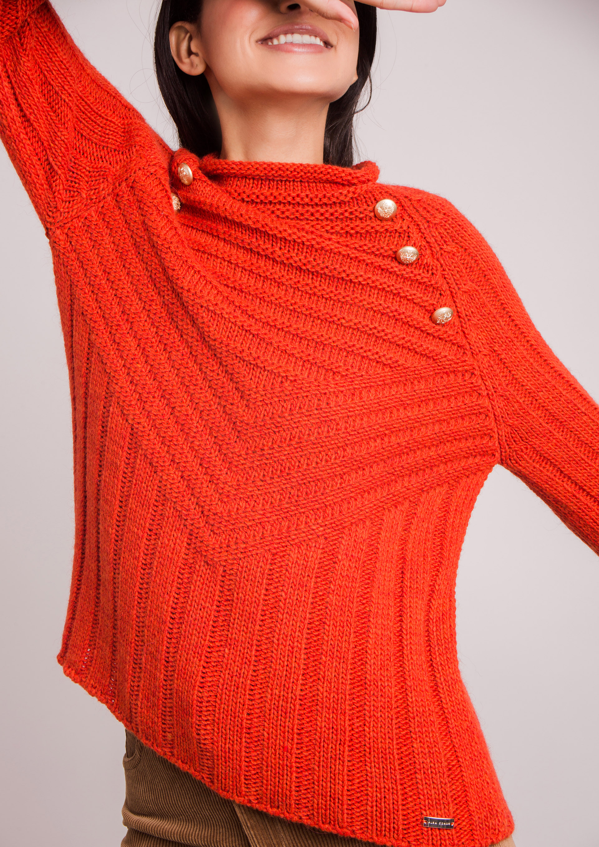 Orange knit sweater.