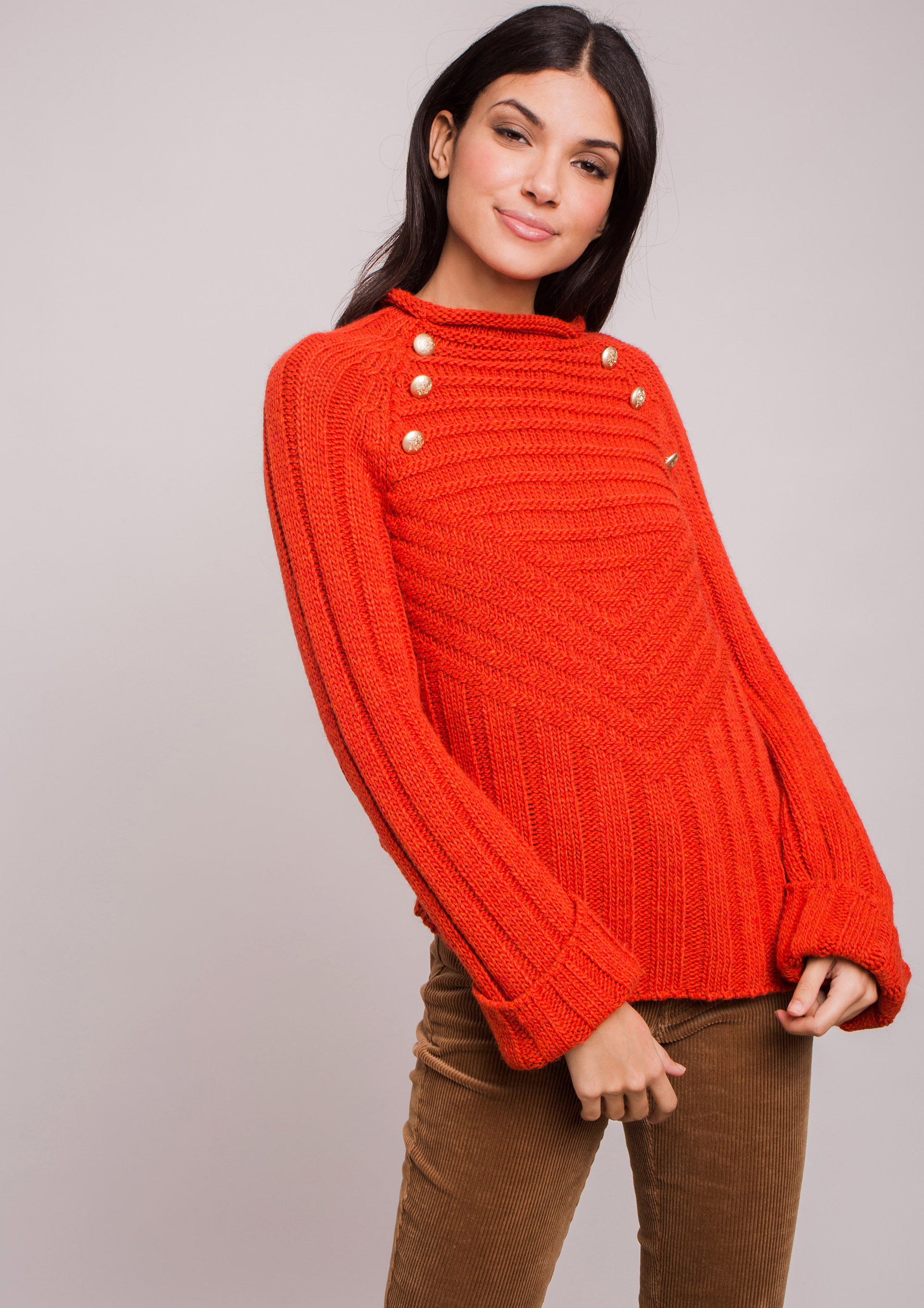 Orange knit sweater.