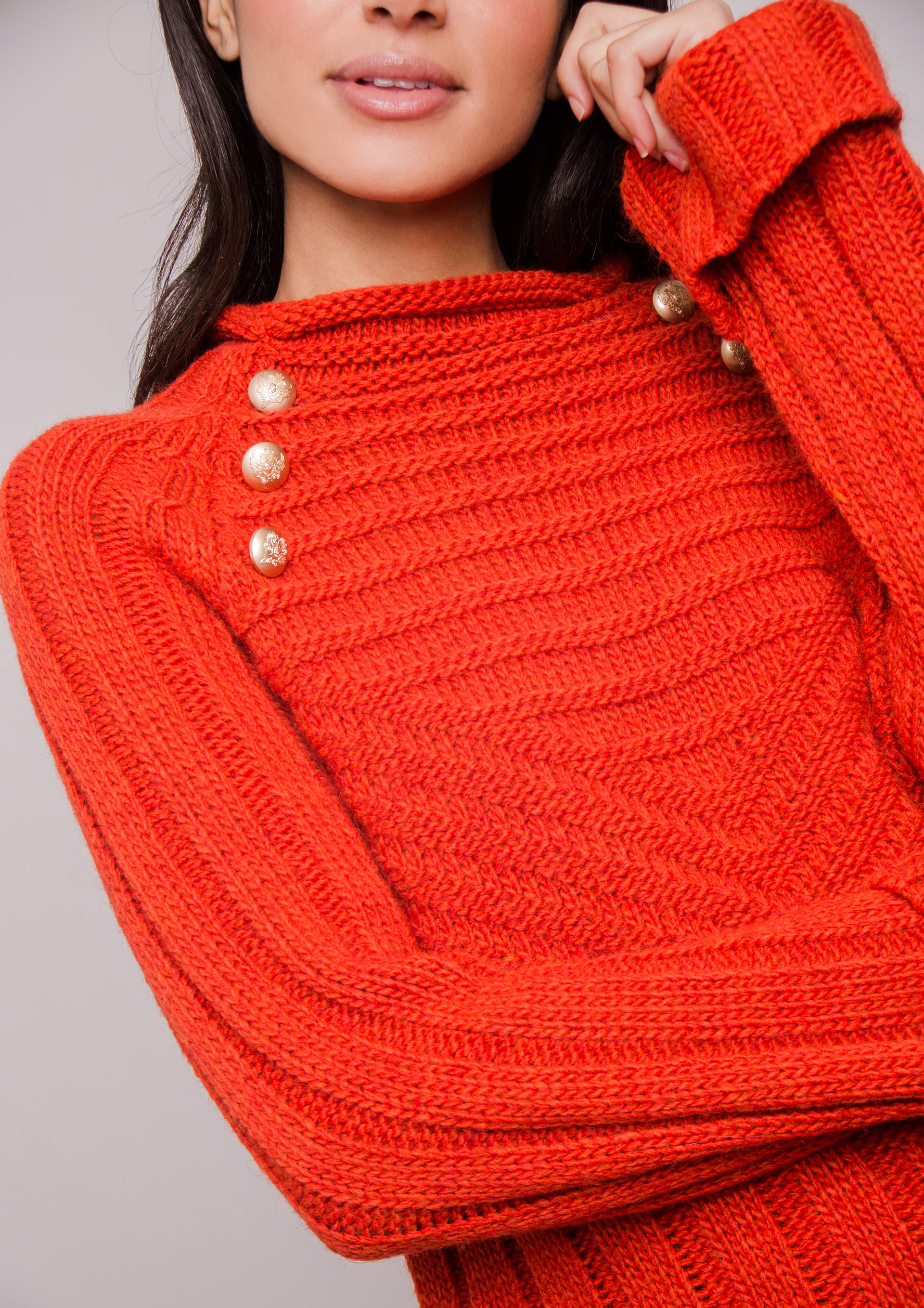 Orange knit sweater.