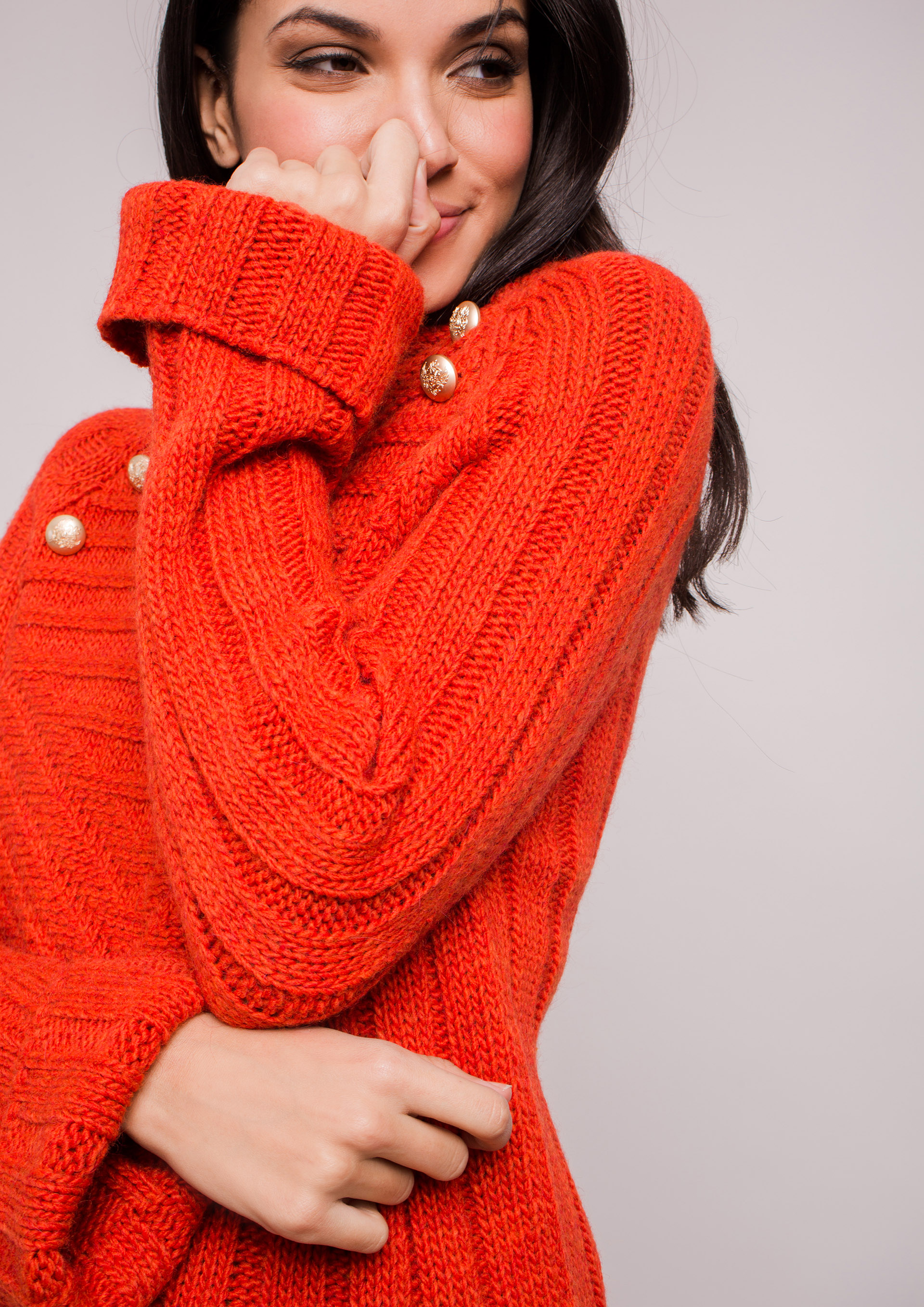 Orange knit sweater.