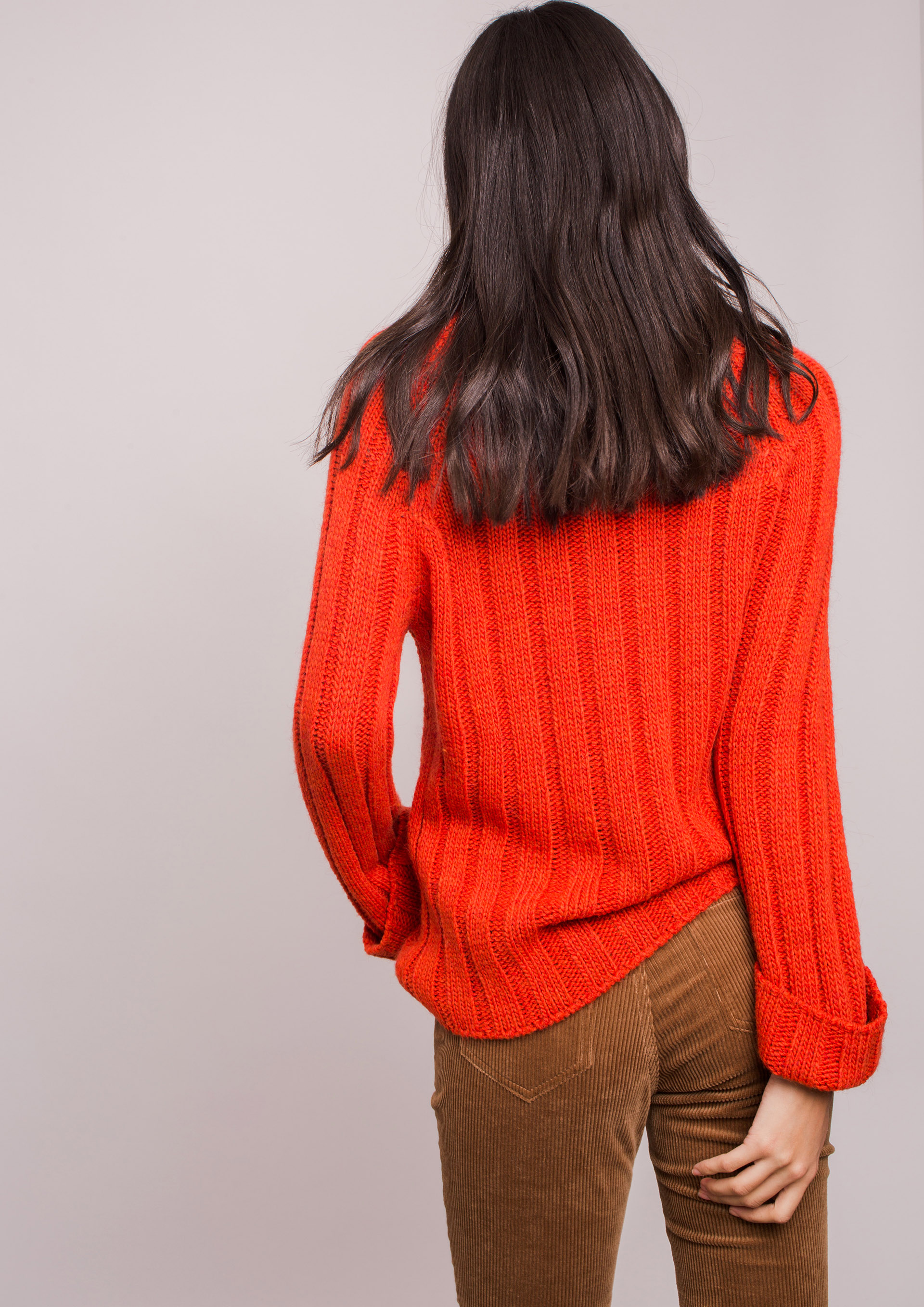 Orange knit sweater.