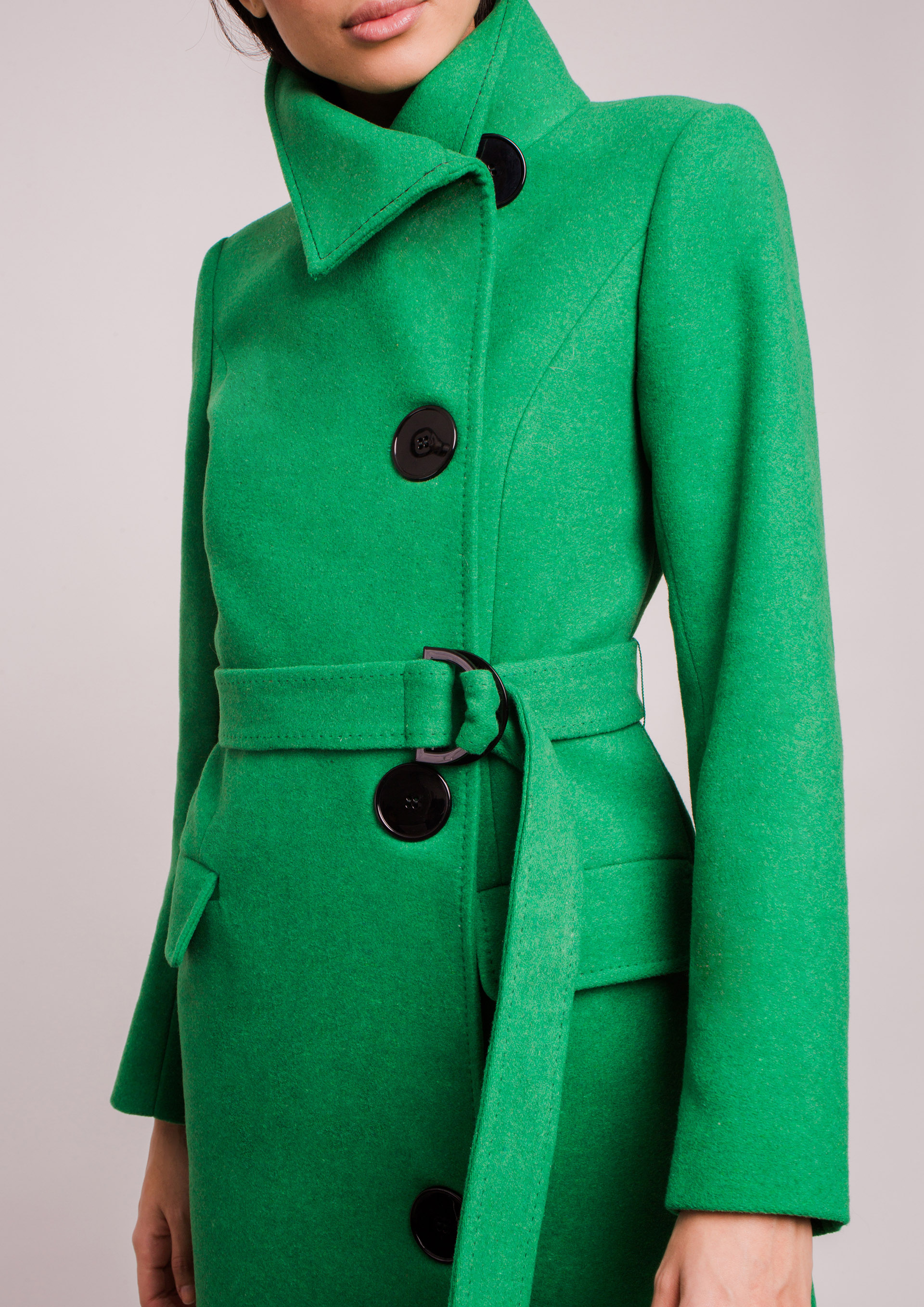 Green coat.
