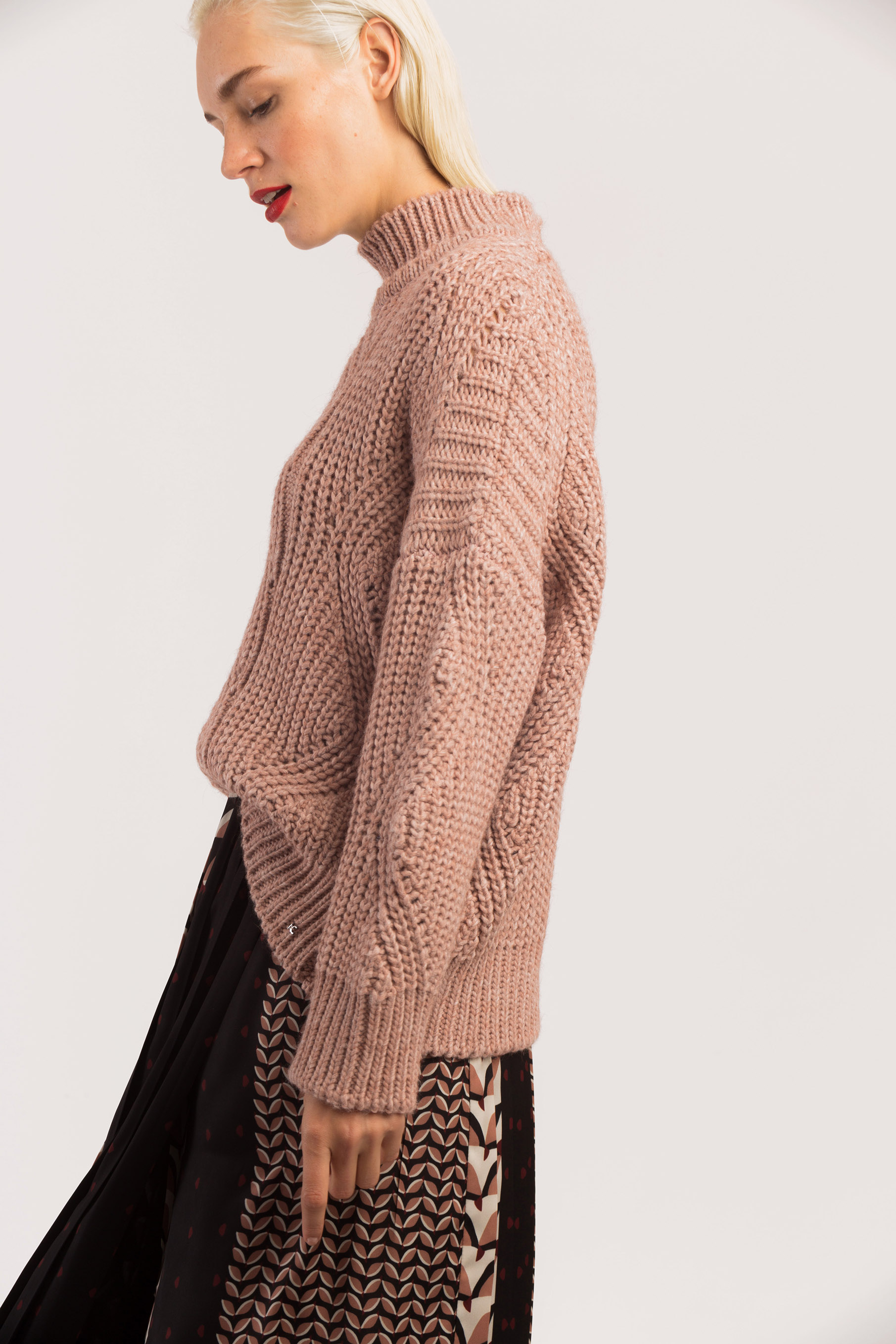 Pink knit sweater.