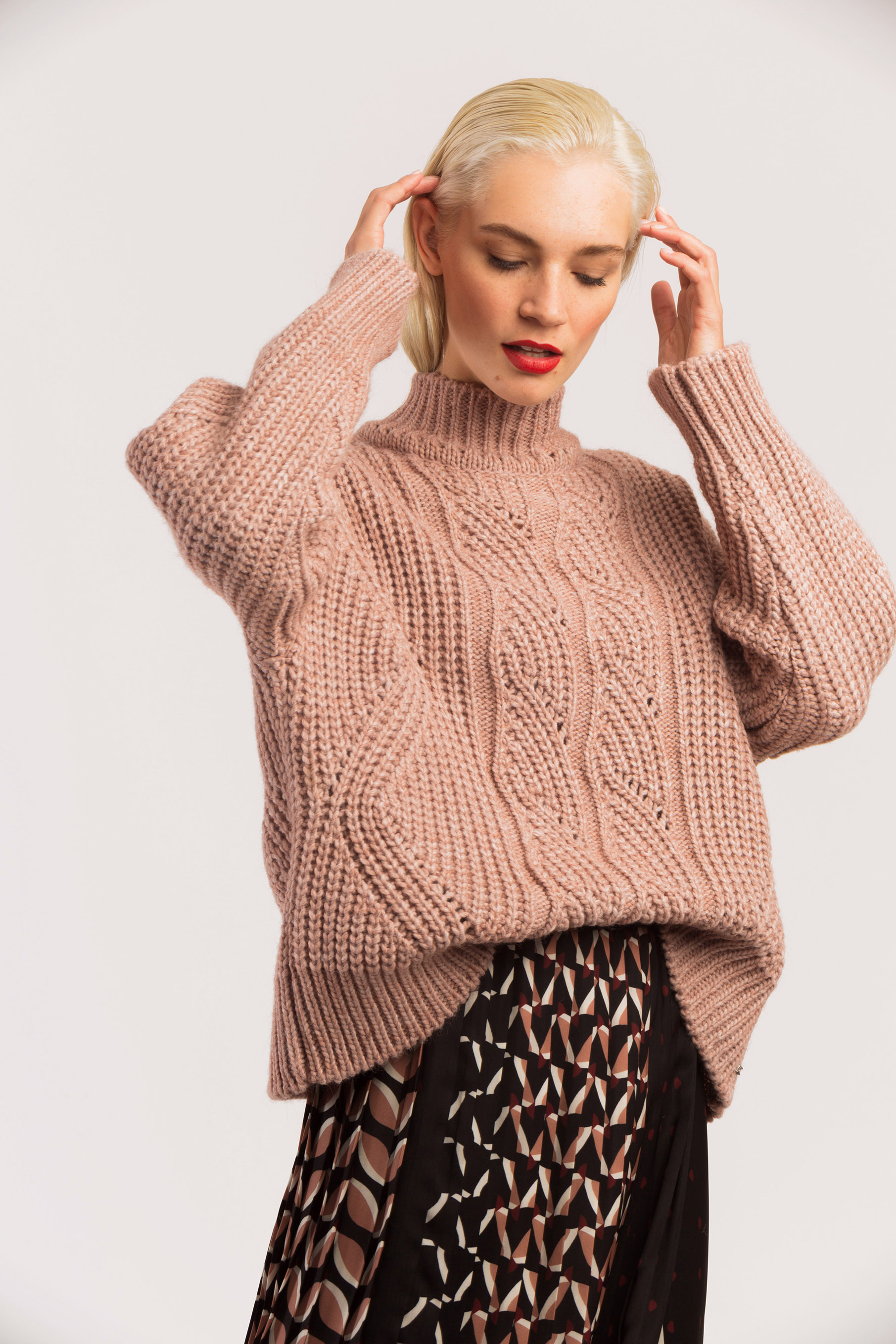 Pink knit sweater.