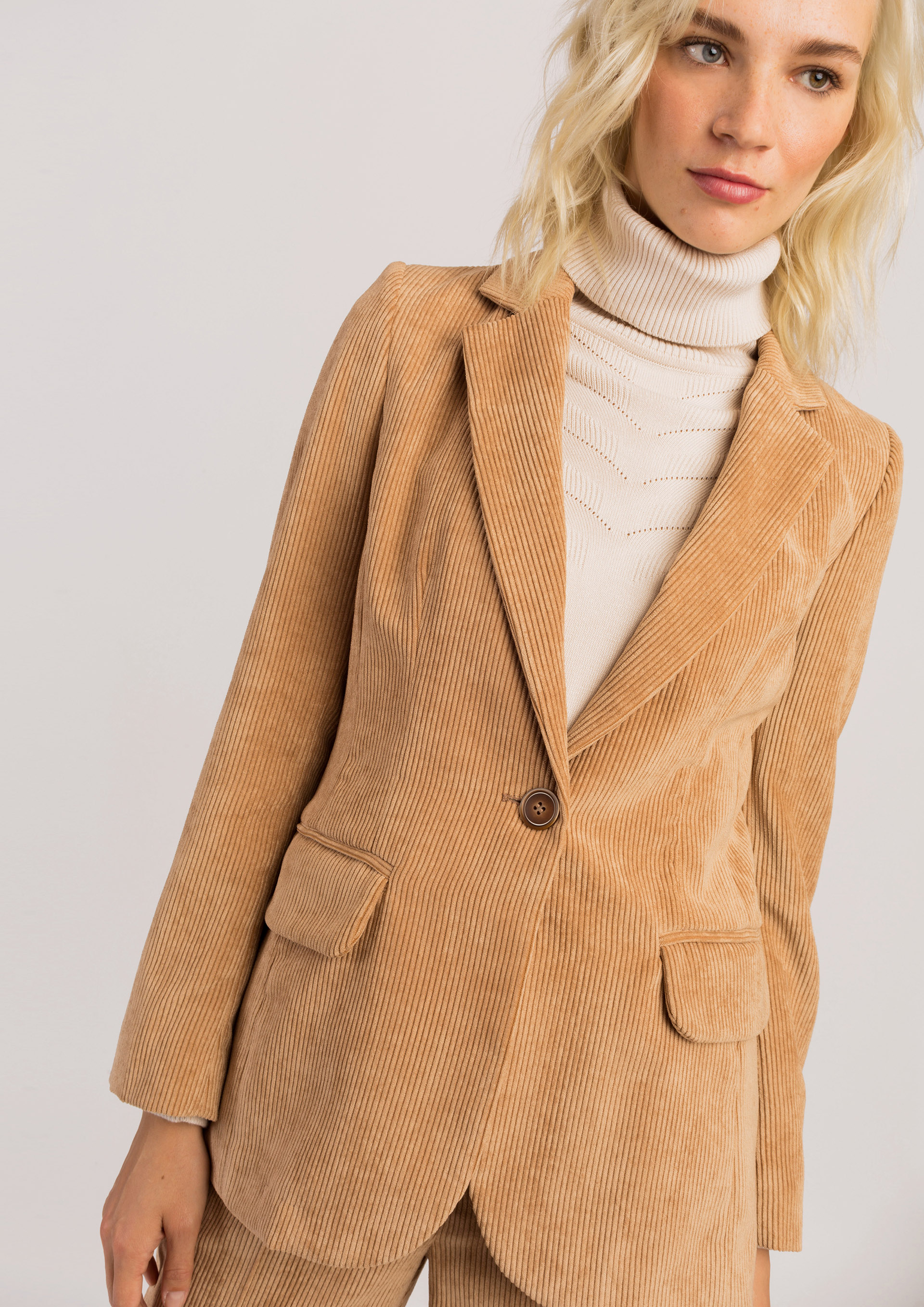 Beige corduroy blazer.