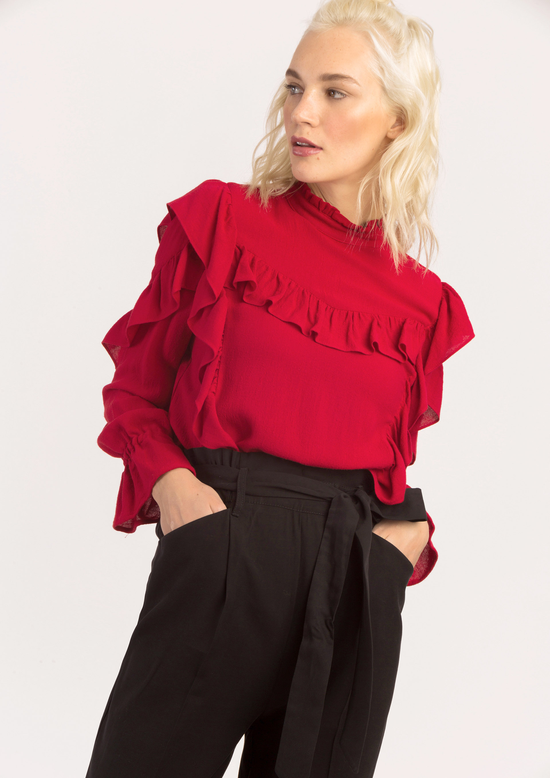 Red blouse with frills.