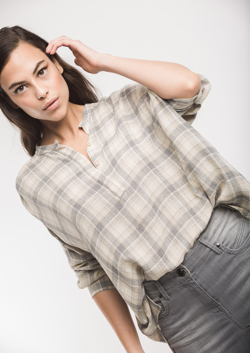 Grey checked blouse.